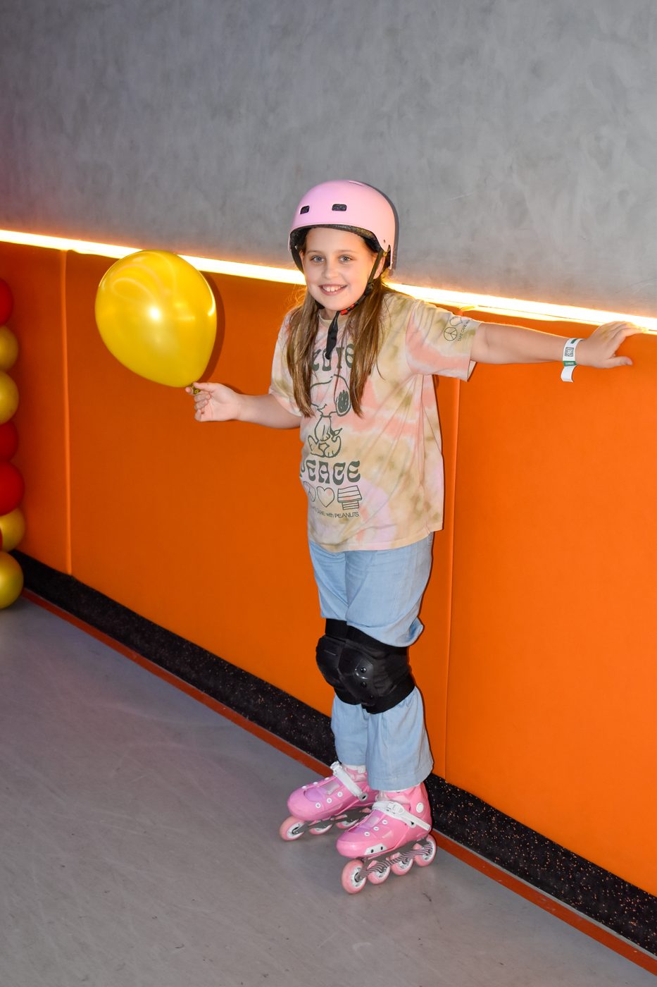 Skater posing with balloons